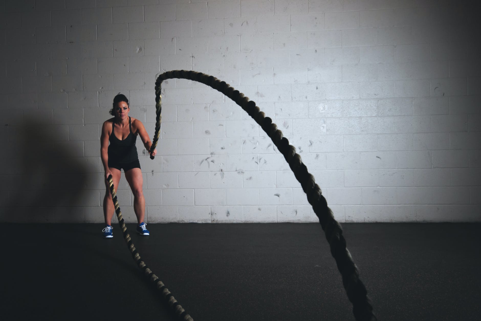 woman holding exercise ropes